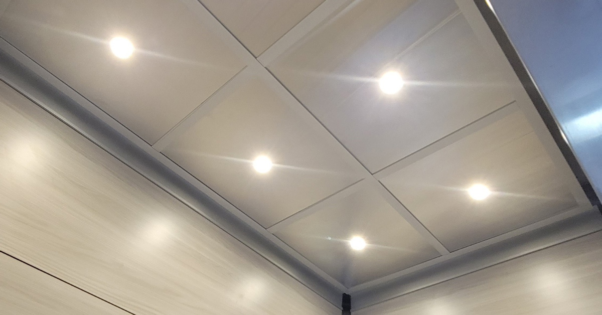 Elevator ceiling clearance light panels